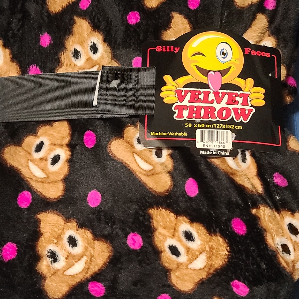 "Silly Faces Velvet Throw" blanket featuring pattern of poop emojis & pink Dots